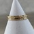  10 k yellow gold decorative scroll band . 