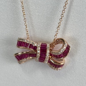  14 k Effy Branded Ruby Royal Diamond Bow Pendant. 
